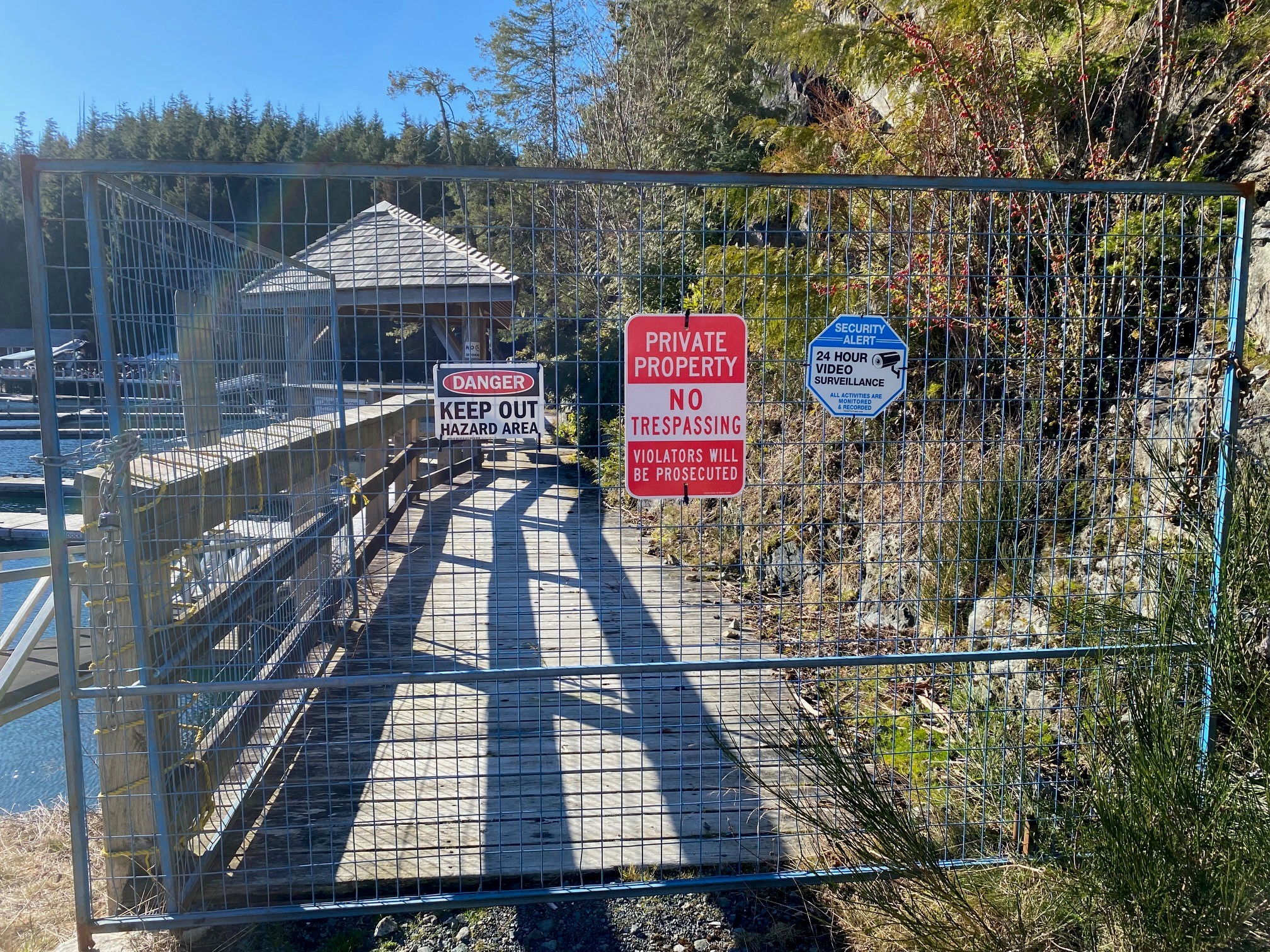 Telegraph Cove Marina & RV Park with No Trespassing and Danger Signs